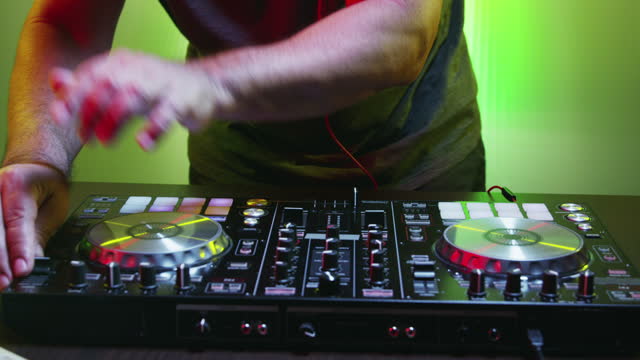 Man of DJ Tweak Various Track Controls on DJ Deck