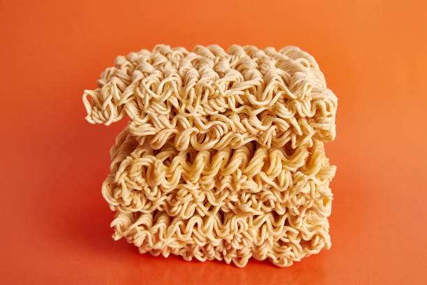 istock Instant vermicelli on an orange background. Instant food. 1499523427