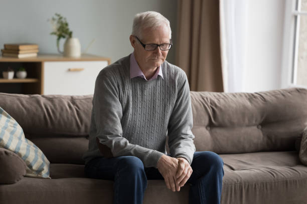 istock Sad depressed elderly man feeling lost, lonely at home 1499524936