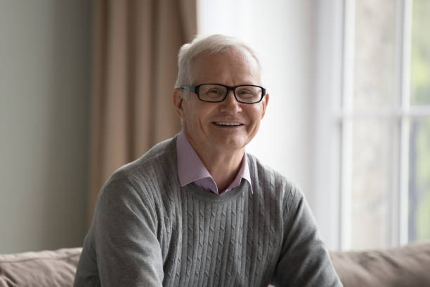 istock Cheerful happy elderly man in eyeglasses enjoying leisure 1499524937