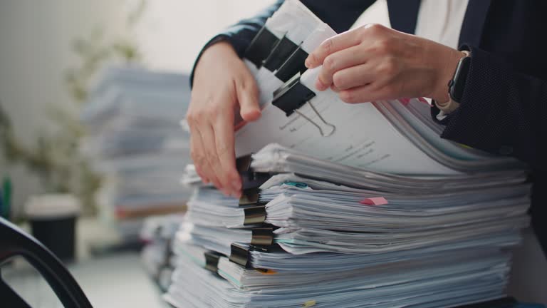 Businesswoman searching documents at the office