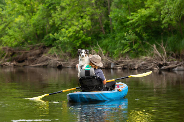 istock Girl & Dog Kayaking Down Rum River in Summer 1499536976