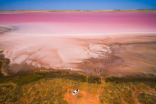 Aerial view of a bright pink salt lake in the South Australian outback