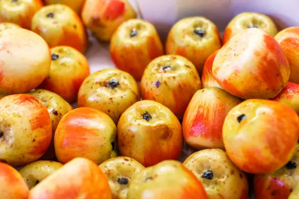 Photo of Marzipan fruits assortment. Close up of marzipan sweets shaped and painted as apple in patisserie shop. Martorana fruit is typical Sicilian dessert of almond paste in Southern Italy