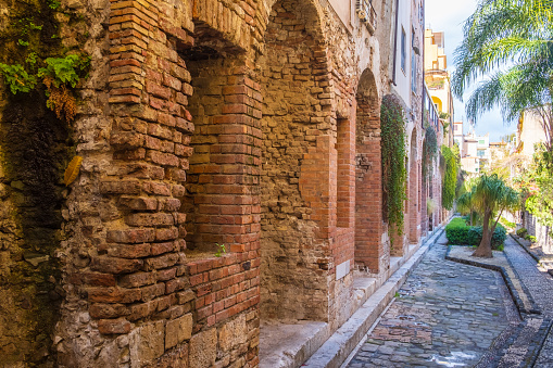 Naumachia or Naumachie of Taormina is ruins of ancient brick wall in Taormina old town on Sicily island, Italy.