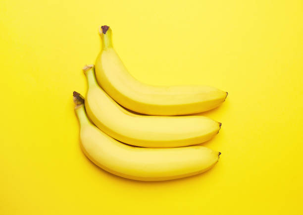 istock Bananas on a yellow background 1499545142