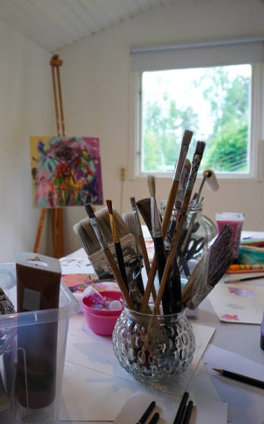 istock painting supplies on table inside a studio 1499547458