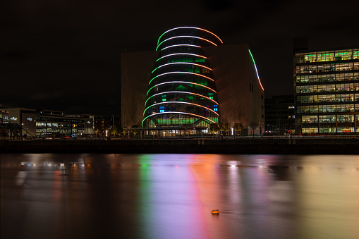 The lights of the Dublin Convention Centre reflected in the river Liffey at night  , Dublin, Ireland