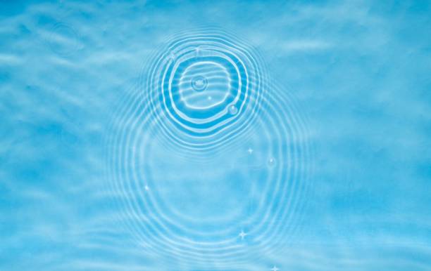 istock Crystal clear swimming pool illuminated by the golden light 1499557728