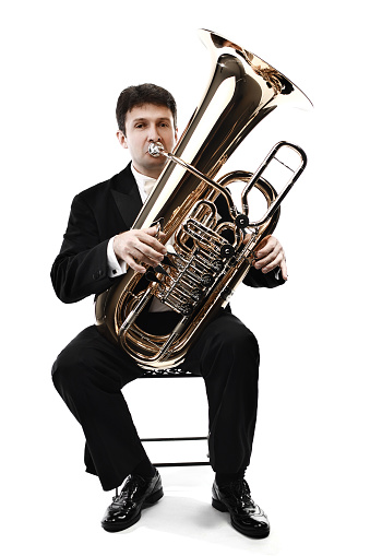 Tuba brass instrument. Wind classical musician isolated on white horn player trumpeter
