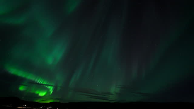 Timelapse of the Aurora Borealis over Icelandic landscape