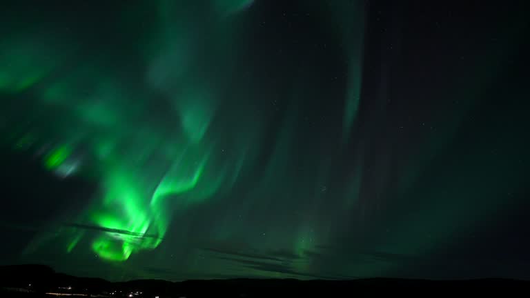 Timelapse of the Aurora Borealis over Icelandic landscape