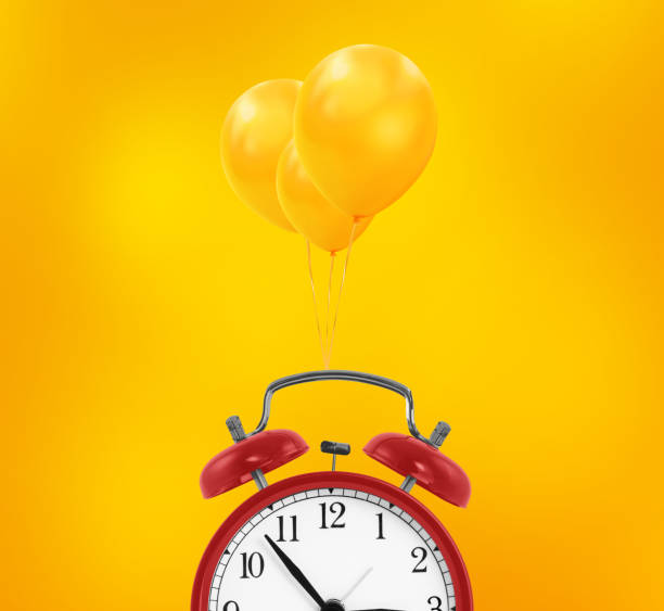 istock Red alarm clock fly by three balloons. minimal Wedding and birthday concept 1499577983
