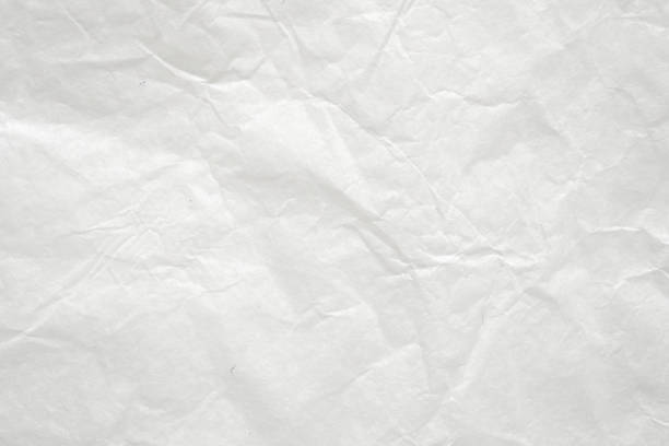 istock Abstract white crumpled and creased recycle paper texture background 1499581474