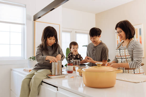 istock Asian parents and two kids in the kitchen 1499582107