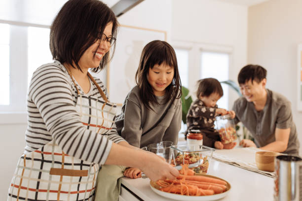istock Asian parents and two kids in the kitchen 1499582122