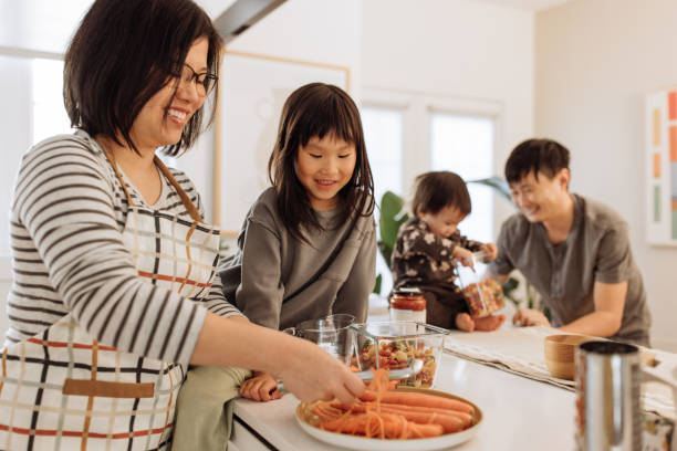 istock Asian parents and two kids in the kitchen 1499582124