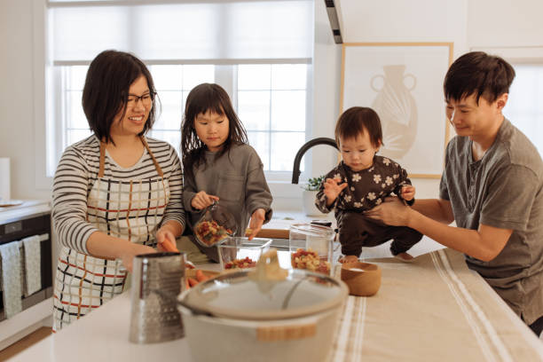 istock Asian parents and two kids in the kitchen 1499582130