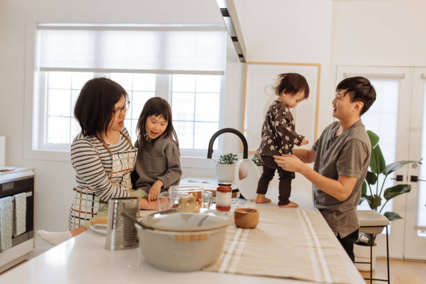 istock Asian parents and two kids in the kitchen 1499582138