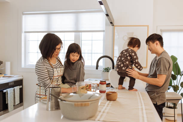 istock Asian parents and two kids in the kitchen 1499582158