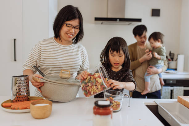 istock Asian parents and two kids in the kitchen 1499582165