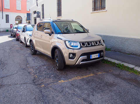 Cremona, Italy - May 2023 Suzuki Ignis Caravan Ivory Pearl Metallic parked in the street.