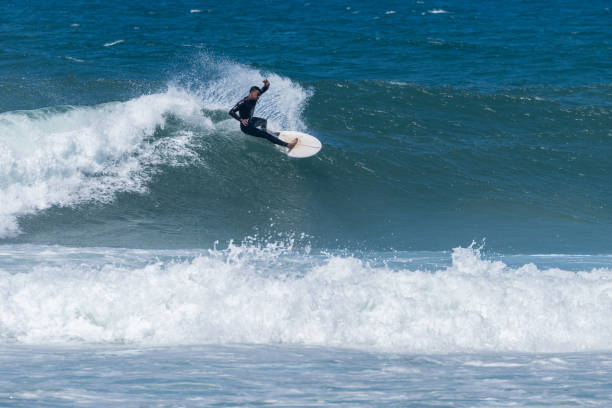 istock Surfer riding waves in Furadouro Beach 1499586442