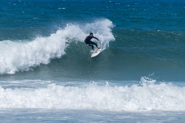 istock Surfer riding waves in Furadouro Beach 1499586451