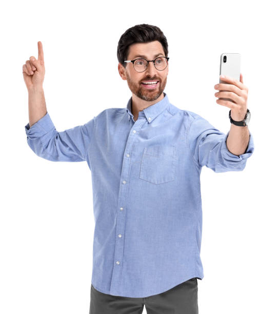 istock Smiling man taking selfie with smartphone on white background 1499592529