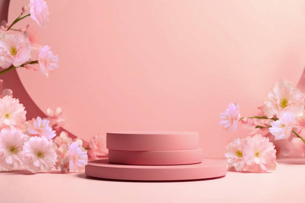 istock Pink round podium with branch of sakura 1499593378