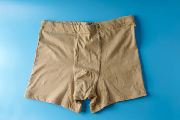 istock Big men's beige underpants on a blue background 1499594127