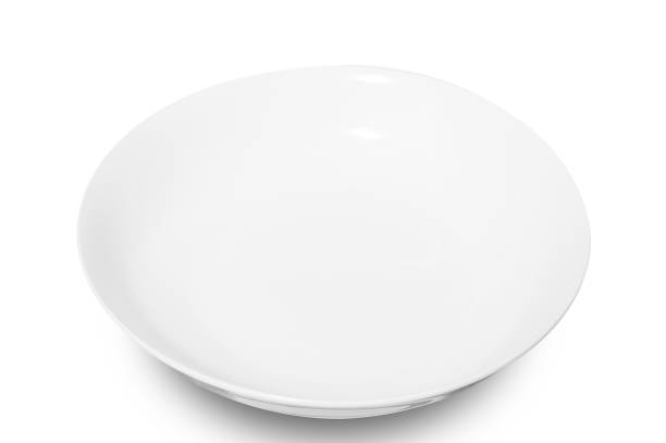 istock White circle ceramics plate isolated on white background. 1499608223