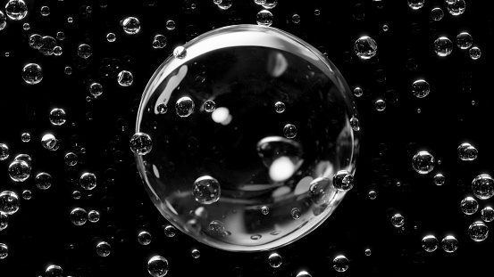 3D Illustration.Multiple bubbles on black background. (horizontal)