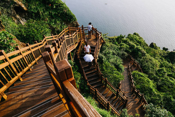 Stairs to climb Seongsan mountain in Jeju Island, South Korea. Jeju, South Korea - July 10, 2022: Stairs to climb Seongsan mountain in Jeju Island, South Korea. jeju city stock pictures, royalty-free photos & images