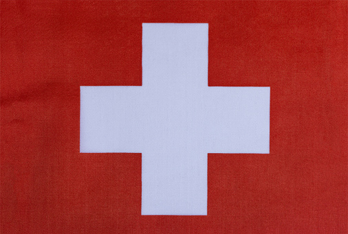 the national flag of Switzerland on a fabric basis close-up