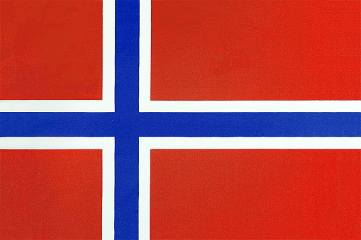 Norwegian national flag on a fabric basis close-up