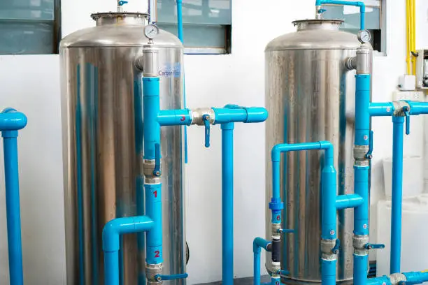 Photo of The picture shows a series of water filters arranged in order to prepare for reverse osmosis drinking water.