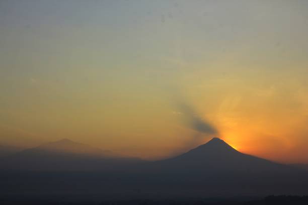 istock Silhouette of Mount Merapi with a red-orange sky at sunrise 1499632330