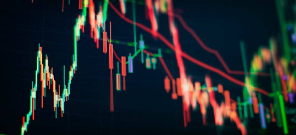 istock Technical price graph and indicator, red and green candlestick chart on blue theme screen, market volatility, up and down trend. 1499635651