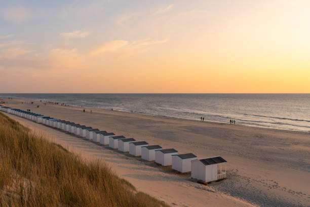 istock On the coast with beach huts whit the sun go down 1499637733