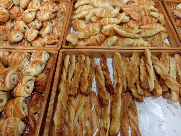 istock Mini croissant bread on display store. freshly backed with various taste like chocolate, cheese, banana. 1499639288