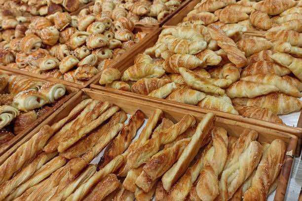 istock Mini croissant bread on display store. freshly backed with various taste like chocolate, cheese, banana. 1499639341