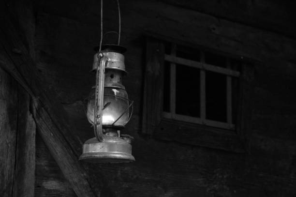 istock lit lantern on an old wooden house 1499639347