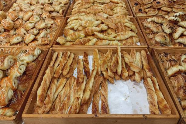istock Mini croissant bread on display store. freshly backed with various taste like chocolate, cheese, banana. 1499639366