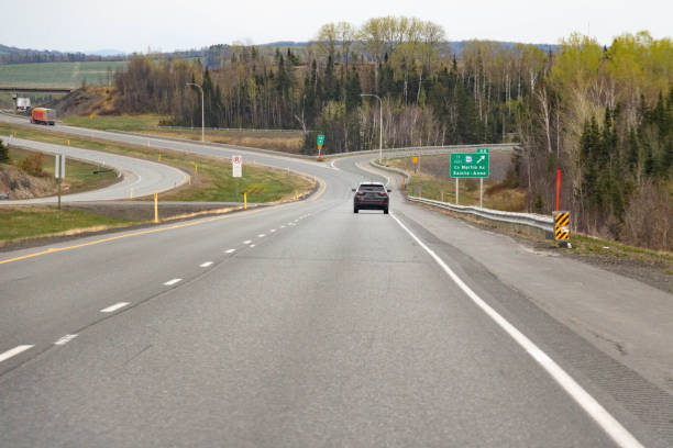 istock car on  road through green hills 1499642621