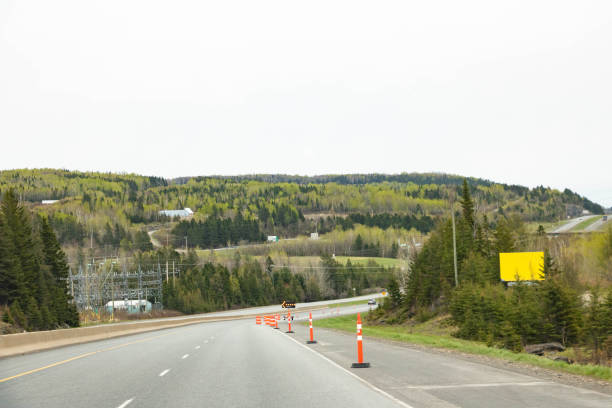 istock traffic cones on side of highway 1499642672