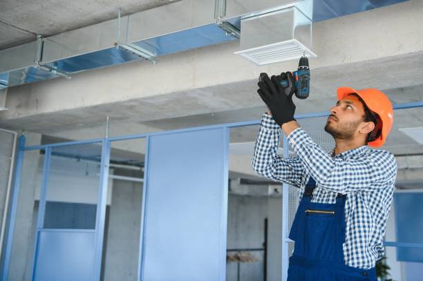 istock hvac services - indian worker install ducted pipe system for ventilation and air conditioning in house 1499645105