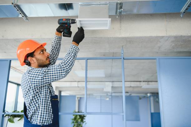 istock hvac services - indian worker install ducted pipe system for ventilation and air conditioning in house 1499645148