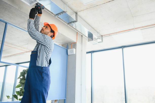 istock hvac indian worker install ducted pipe system for ventilation and air conditioning. copy space 1499645154