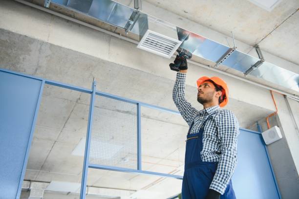 istock hvac services - indian worker install ducted pipe system for ventilation and air conditioning in house 1499645156